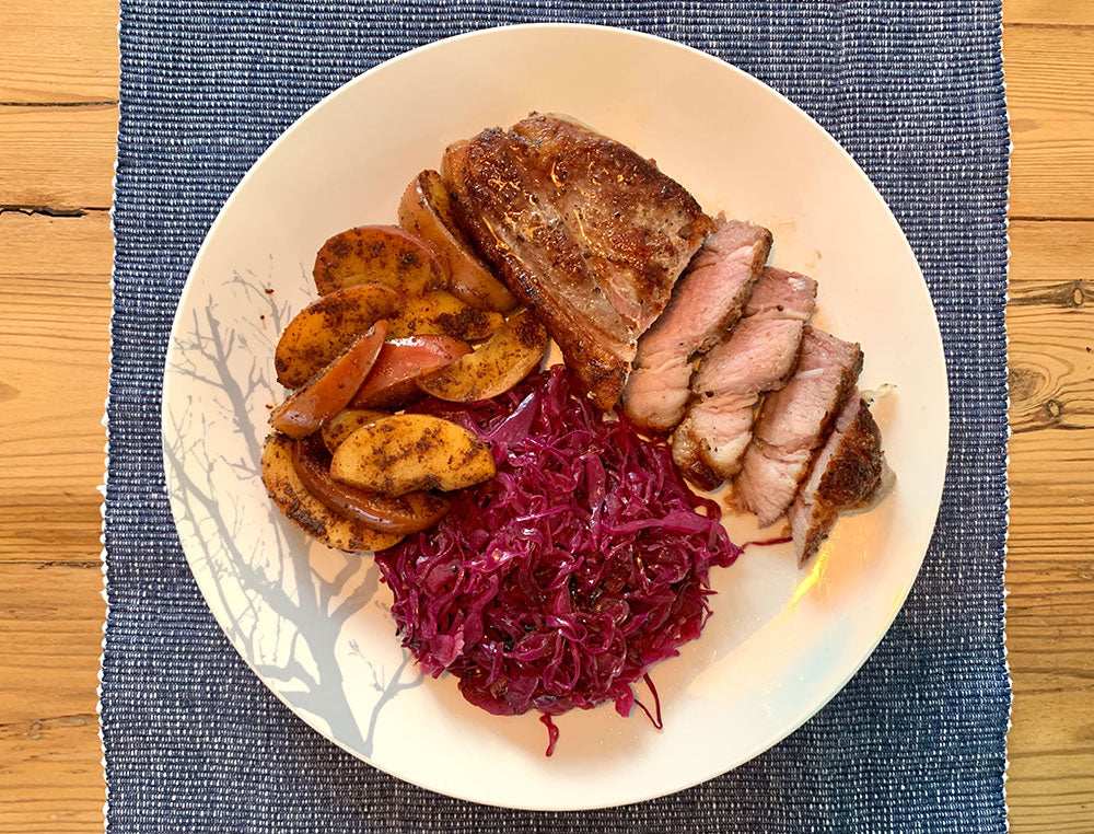Pork steak with braised red cabbage and apple